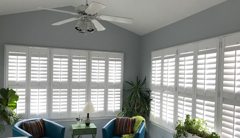 Denver living room with fan and shutters